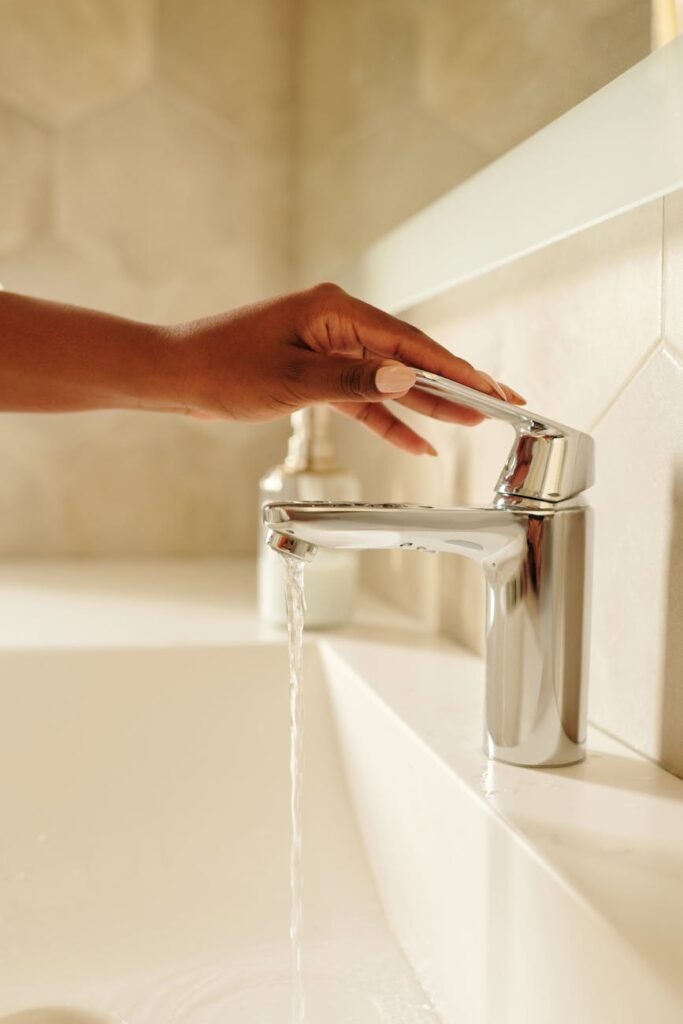 person holding a faucet